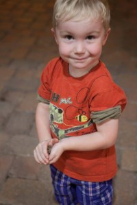 Child holding a frog